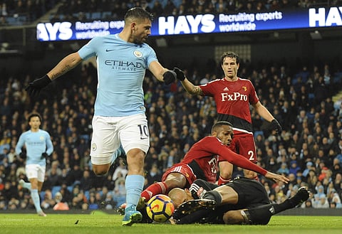 Watford's goalkeeper Heurelho Gomes collides with Watford's Molla Wague while Sergio Aguero scores goal for Manchester City.   (Photo |AP)