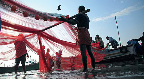 The new year has brought in fresh hopes to the fishermen, who have been affected by the cyclone Ockhi. A group of fishermen arranging their nets for the job at Chellanam harbour in Kochi | K Shijith