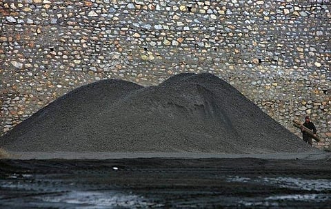 A Chinese miner works at a coal mine in the suburb of Tangshan, China's Hebei province December 9, 2005. (Photo | Reuters)