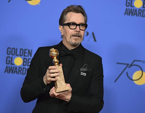 Gary Oldman poses in the press room with the award for best performance by an actor in a motion picture - drama for 'Darkest Hour' at the 75th annual Golden Globe Awards at the Beverly Hilton (Photo | AP)