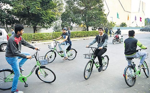 People trying out PEDL's public bicycle sharing service in Koramangala