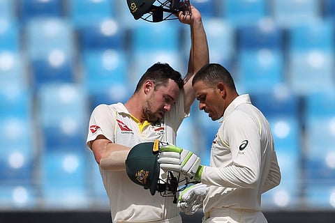 Australia's Travis Head (L) and Usman Khawaja take a break during their test match against Pakistan in Dubai | AP