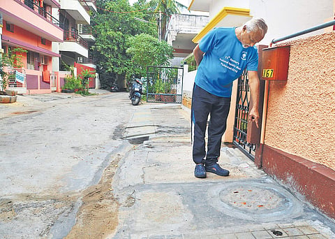 Gopal Rao points out the pipeline that’s clogging the sewage  (Photo | Pushkar V)