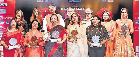 Winners of the 2018 Devi Awards with Maharashtra Chief Minister Devendra Fadnavis and Editorial Director of The New Indian Express and The Sunday Standard,  Prabhu Chawla, in Mumbai on Wednesday. | EPS