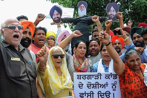 A file photo of AAP activists protesting against former Chief Minister Parkash Singh Badal SAD B president Sukhbir Singh Badal and Bikram Singh Majithia for their alleged role in the incidents of desecration of Sri Guru Granth Sahib in Amritsar on Thursda
