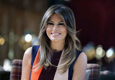 First lady Melania Trump takes a seat during a visit to The Royal Hospital Chelsea in central London. (Photo | AP)