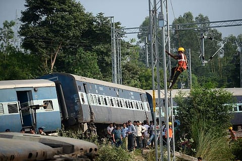 National Disaster Response Force carry on rescue operations while onlookers stand at the site where the engine of the New Farakka Express train derailed along with eight coaches near Harchandpur Railway station in Rae Bareli on October 10, 2018. | (File |