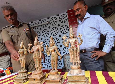 Pon Manickavel IG Idol Wing and Shanmuga Rajeswaran IG south zone seen along with the recovered Panchaloha idols at Sozhavandhan police station in Madurai district on Tuesday. | Express Photo Services