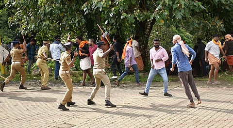 Police lathi-charge on the protestors after they opposed the entry of girls and women of menstrual age into the hill shrine of Lord Ayyappa Temple in Sabarimala Kerala Wednesday Oct 17 2018. | PTI
