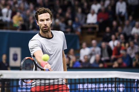 Ernests Gulbis of Latvia returns to John Isner of US, during their semi-final of the Stockholm Open tennis tournament | AP