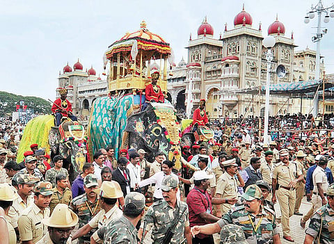 Elephant Arjuna marches on the premises of the Mysuru palace carrying the 750-kg golden howdah with  the idol of Goddess Chamundeshwari during the Jamboo Savari, on Friday | Udayashankar S