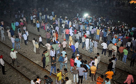 People gather near the site of a train accident at Joda Phatak in Amritsar | PTI