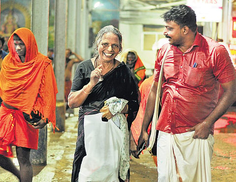 A malikappuram (woman devotee) returning after darshan at Sannidhanam in Sabarimala on Saturday  | A Sanesh