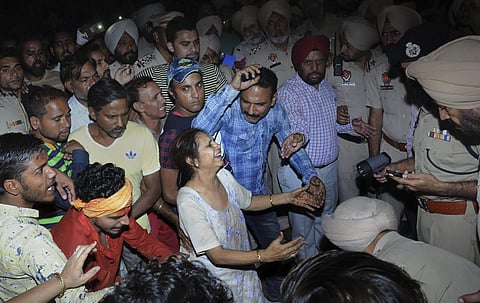 Relatives mourn at the site of a train accident at Joda Phatak in Amritsar. | PTI