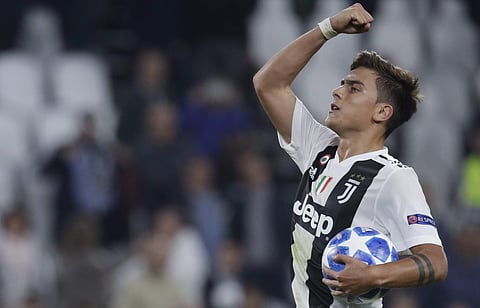 Juventus forward Paulo Dybala holds the ball after scoring a hat trick at the end of the Champions League, group H soccer match between Juventus and Young Boys, at the Allianz stadium. (Photo | AP)