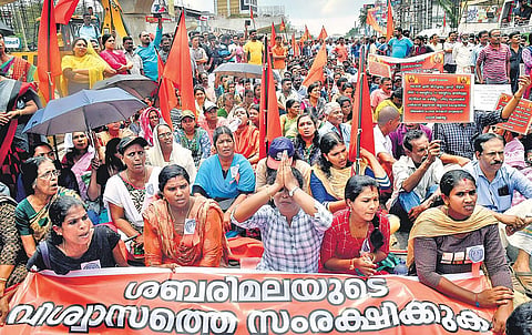 Members of Sabarimala Samrakshana Samithi staging a protest by blocking Vyttila Junction against the Supreme Court verdict on Sabarimala in Kochi on Tuesday | Express