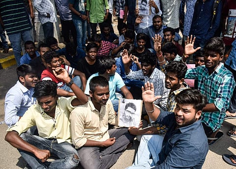 Nizam College students protest at the entrance gate of college demanding justice for the student  Vijay who died on Wednesday night(Photo | EPS /Vinay Madapu)