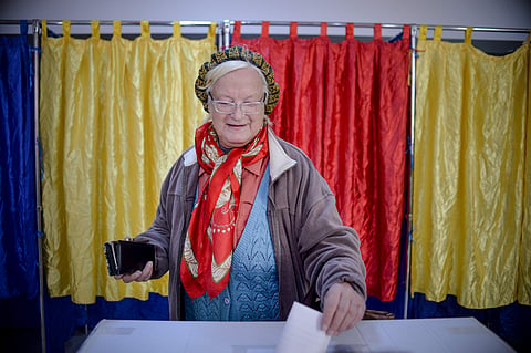 A woman casts her vote, in Bucharest, Romania | AP