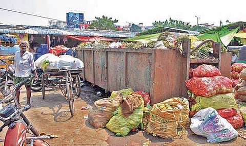Overflowing garbage bins at a Rythu Bazaar in Vijayawada as sanitation workers continue their indefinite strike (File | EPS/RVK Rao)