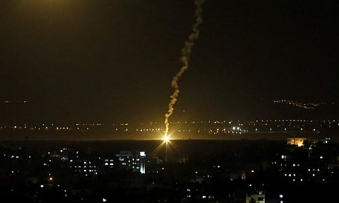 Flares fired from Israeli forces light up the night sky in Gaza City | AP