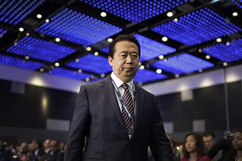 Interpol President, Meng Hongwei, walks toward the stage to deliver his opening address at the Interpol World congress in Singapore. (File photo | AP)