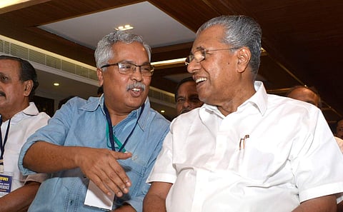 Kerala CM Pinarayi Vijayan sharing a light moment with CPI national secretary Binoy Viswam at the inauguration of KUWJ state conference in Kozhikode. (Photo | Manu R Mavelil/EPS)