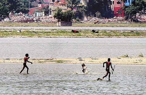 Boys poaching Pelicans after the migratory birds fell into their traps laid in the Korattur lake. Later when some  locals reprimanded them, t