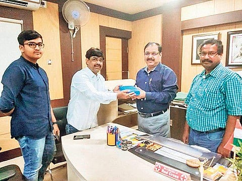 Jajpur Collector Ranjan Das greets Sajal Chatterji (2nd from left) in his office I express