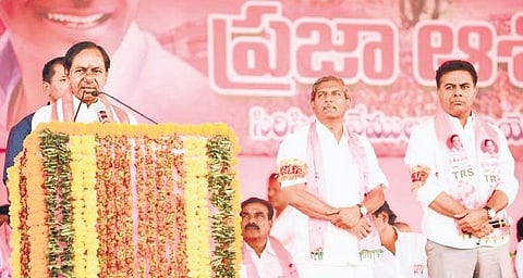 TRS president K Chandrasekhar Rao addressing an election meeting in Sircilla on Tuesday. Party candidates  KT Rama Rao (Sircilla) and Chennamaneni Ramesh (Vemulawada) are also seen | Express PHOTO