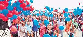 Students and participants release 1,000 balloons as part of Child Rights Week in Hawa Beach at Kovalam, Thiruvananthapuram