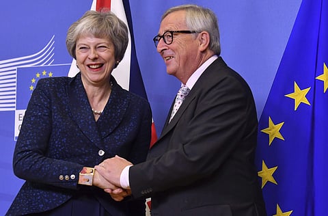 European Commission President Jean-Claude Juncker, right, greets British Prime Minister Theresa May at EU headquarters in Brussels (Photo | AP)