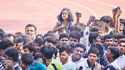 A young fan waits to get a last glimpse of Ambareesh  at Kanteerava Stadium on Sunday | Pandarinath B