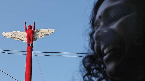 A flag made of sanitary napkins being hoisted as part of ‘Arpo Arthavam’ campaign held at Vanchi Square in Kochi 