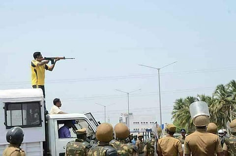 In this 22 May 2018 photo, a police personnel shoots at the protesters protesting against the copper smelting plant in Thoothukudi. (Photo | EPS)
