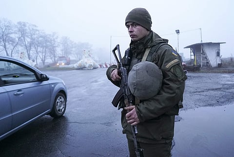 A Ukrainian national guard soldier stands in position at the checkpoint in near the city of Mariupol, south coast of Azov sea, eastern Ukraine, Tuesday, Nov. 27, 2018. (Photo | AP)