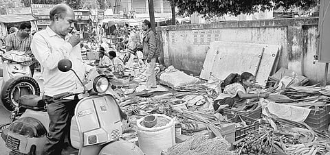 A man buying turmeric leaves on the eve of Prathamastami in Baripada | Express