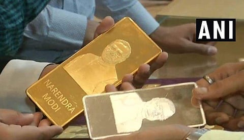 A jewellery shop in Surat is selling gold and silver bars with faces of PM Modi and former PM Atal Bihari Vajpayee engraved on them. | Image Courtesy: ANI