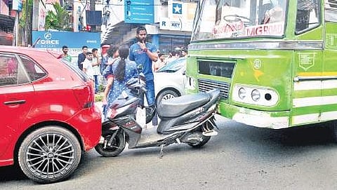 The commotion at Palarivattom Junction after a private bus rammed into a scooter, which in turn hit a car, on Monday A Sanesh