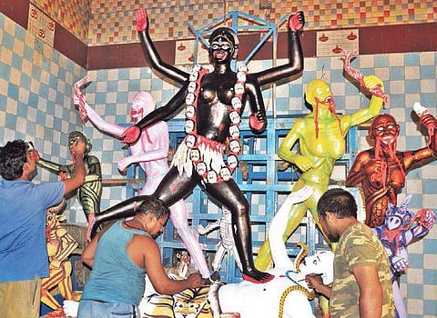 Artisans giving finishing touches to idols at Sutahat pandal on Monday. | Express Photo Service