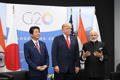 Leaders of Japan, America, India pose after the first-ever trilateral Summit 'JAI'. (Photo: Twitter / MEAIndia)