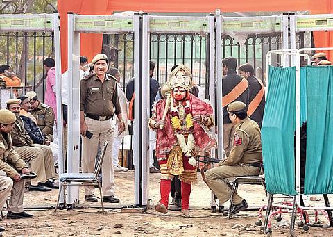 A man dressed as Lord Hanuman arrives at Ramlila Maidan on Sunday