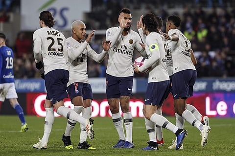 PSG's Edinson Cavani, with the ball, celebrates with teammate after scoring a goal during the League One soccer match between Strasbourg and Paris Saint Germain at the Stade de la Meinau stadium in Strasbourg, eastern France, Wednesday Dec.5, 2018.  | AP