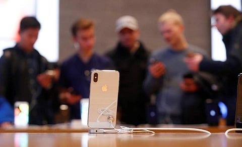 People look at iPhone X during its launch at the Apple store in Berlin. (Photo | Reuters)