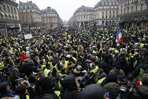 Demonstrators gather during a protest outside the Opera house, Saturday, Dec. 15, 2018 in Paris.  (Photo | AP)
