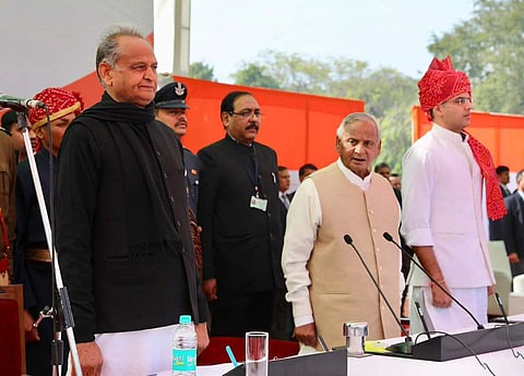 Rajasthan CM Ashok Gehlot (L), Governor  Kalyan Singh (M) and deputy CM Sachin Pilot (R) at the swearing-in ceremony.(Photo| Twitter/Congress)