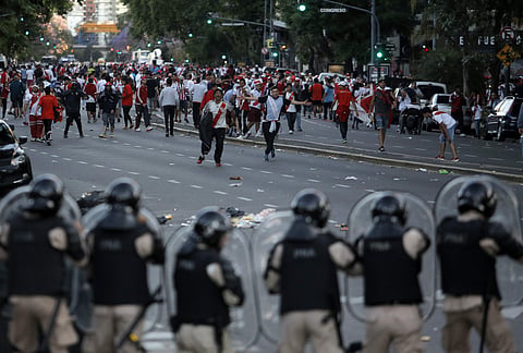 River Plate fans clash with riot police outside the Antonio Vespucio Liberti stadium prior the final of the Copa Libertadores between River Plate and Boca Juniors, in Buenos Aires, Argentina (File photo | AP)