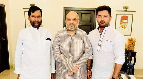 LJP chief Ram Vilas Paswan (L) and son Chirag Paswan with BJP president Amit Shah. (Source: irvpaswan-Twitter‏/File)