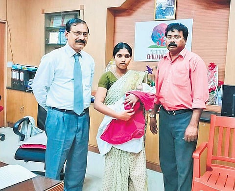 Dr A T Arasar Seeralar and Dr G K Jaikaran with S Jayanthi, mother of the  four-month-old baby boy, who underwent the open-heart surgery. | Express Photo Services