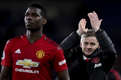 Manchester United manager Ole Gunnar Solskjaer claps after the English Premier League match between Cardiff City and Manchester United at the Cardiff City Stadium in Cardiff, Wales, Saturday Dec. 22, 2018. | AP