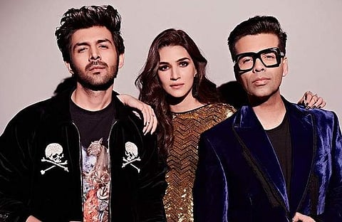 Bollywood actors Kartik Aaryan and Kriti Sanon with filmmaker Karan Johar (Photo | Karan Johar Instagram)